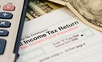 Why do partners sometimes report more income on tax returns than they receive in cash?
